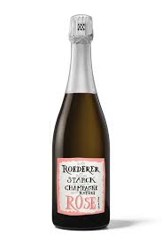 Bottle of Roederer Cristal Rosé champagne with a silver foil top on a white background