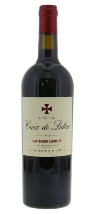 Red wine bottle with a visible label on a white background