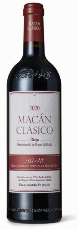 Bottle of Macan Clasico wine with a red label on a white background
