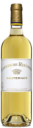 Bottle of L'Archeveche de Rieussec Sauternes wine with a gold cap and white label.