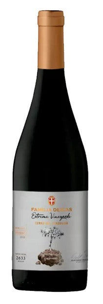 Red wine bottle with a gold cap on a white background