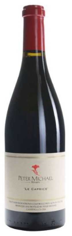 Red wine bottle labeled 'Peter Michael Le Caprice' on a white background