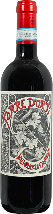 Red wine bottle with a label featuring black and white graphics and text.